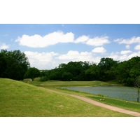 Crystal Falls Golf Course's par-3 eighth hole is played over water. 