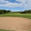 View of a bunker and green from Live Oak Golf Club.