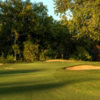 A view of a green protected by bunkers at Onion Creek Club